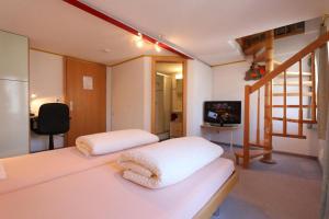 Hotel Alpina客房内的一张或多张床位
