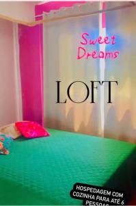 a bed with a sign that reads sweet dreams loft at Ville Sweet Home in Canoa Quebrada