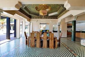 a dining room with a table and chairs at Domaine K Marrakech in Marrakesh