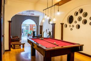 a room with a pool table in a room at Hotel Cuenca in Cuenca