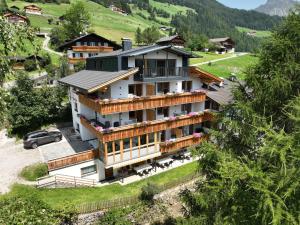 an aerial view of a house in a mountain at App Hubertus - Speikboden in Sand in Taufers