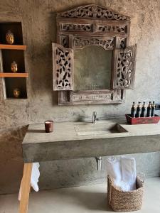 a bathroom with a sink and a mirror at Pocinhobay in Madalena