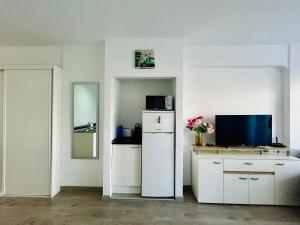 A television and/or entertainment centre at Angel's house at Club Atlantis