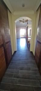 a hallway in a house with a ceiling fan at Domina coral bay elisir SPA in Sharm El Sheikh