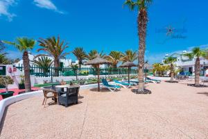 Der Swimmingpool an oder in der Nähe von Vivienda Vacacional Casa Mar y Volcan Vista mar Piscina Playa 5 min Wifi