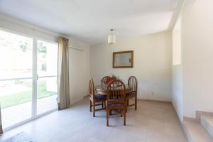 a dining room with a table and chairs at Villas Huitepec in San Cristóbal de Las Casas