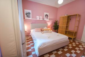 a bedroom with a bed with a table on it at Telesio Suite in Rome