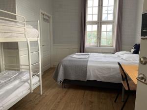 Katil atau katil-katil dalam bilik di Halmstad Hotell & Vandrarhem Kaptenshamn