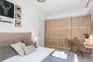 a bedroom with a large bed and a desk at Ethereal Spirit - Greecing in Athens
