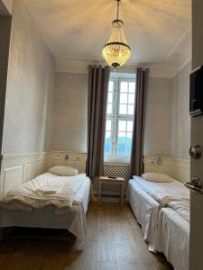 Katil atau katil-katil dalam bilik di Halmstad Hotell & Vandrarhem Kaptenshamn
