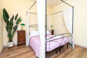 Postel nebo postele na pokoji v ubytování La Locanda del Geco