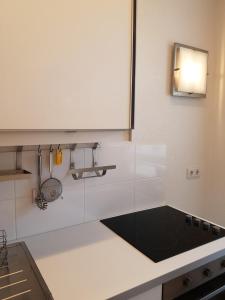 a kitchen with a white counter top with a sink at Appartement "Hope" in Greiz