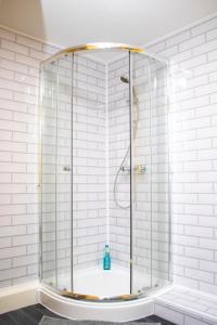 a shower with a glass enclosure in a bathroom at Central Blissful Haven in Liverpool