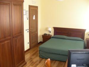 En eller flere senge i et værelse på Villa Del Poeta