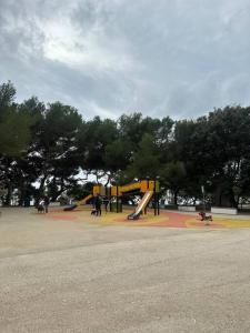 a playground with a slide in a park at MaMi a 2 passi dal mare in Genoa