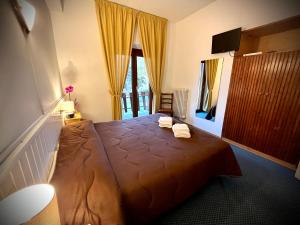 Posteľ alebo postele v izbe v ubytovaní Hotel Pinguino