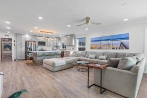 a living room with a couch and a kitchen at On the Boardwalk in Long Beach