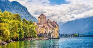 a castle on a island in the middle of a lake at L'échappée étoilée - Métabief in Métabief