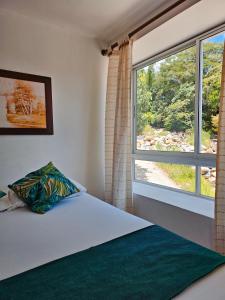 Postel nebo postele na pokoji v ubytování Hosteria La Medusa
