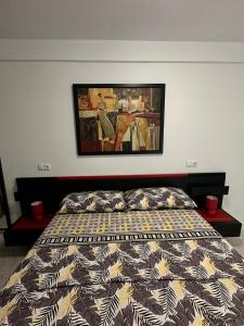 a bedroom with a bed and a painting on the wall at Apartment for 4 person! Viña del mar in Playa de las Americas