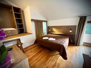 Posteľ alebo postele v izbe v ubytovaní Hotel Pinguino