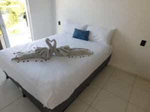 Ένα ή περισσότερα κρεβάτια σε δωμάτιο στο Coral Views Resort - Villa uMaMi