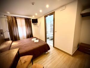 Posteľ alebo postele v izbe v ubytovaní Hotel Pinguino