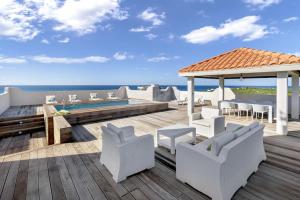 a deck with a gazebo and a swimming pool at Fine 3 BR Oceanview Penthouse in Prime Location - La Perla Sky in Cupecoy