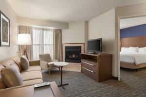 a hotel room with a bed and a television at Residence Inn San Jose South/Morgan Hill in Morgan Hill