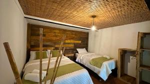 Postel nebo postele na pokoji v ubytování Hotel Campestre mirador CaloPala
