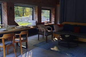 a living room with a couch and chairs and a table at Depo Loco ( Banícke depo) in Špania Dolina