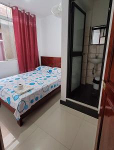 מיטה או מיטות בחדר ב-Hospedaje Vista Paraíso