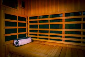 a sauna with a roll of toilet paper sitting on a bench at Mtn Views - Sauna - Hot Tub - Health - Wellness in Massanutten