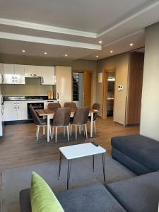 a living room with a couch and a table at Dominium Residence in Agadir