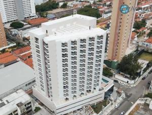 an overhead view of a white building in a city at Acquarius Residence Vista Mar in Fortaleza