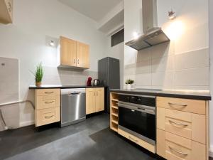 Køkken eller tekøkken på AS Home RYNEK 3-Rooms Apartment R243