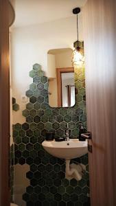 a bathroom with a sink and a mirror at Bonaca Apartments in Budva +42 photos