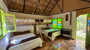 a room with two bunk beds and a desk at Hotel Campestre mirador CaloPala in Machetá