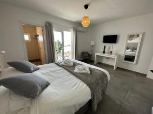 En eller flere senge i et værelse på Casa Volcano