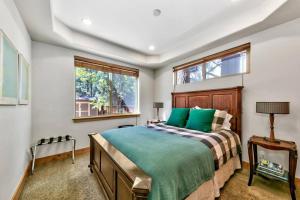 a bedroom with a bed and a window at Tahoe Cozy Cabin, 2 Bedroom with a gas fireplace. in South Lake Tahoe