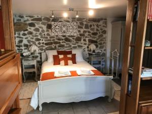 Postel nebo postele na pokoji v ubytování Petit coin de paradis