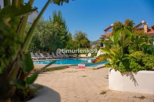 Stunning Suite in Ölüdeniz with Seaview And Pool内部或周边的泳池