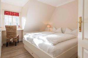 En eller flere senge i et værelse på Wattvogel Lodge