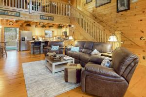 a living room with a couch and a table at Copper Lantern in Ellijay