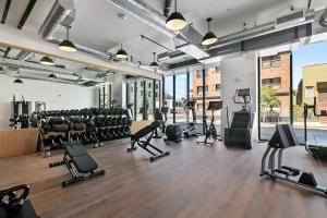 a gym with treadmills and exercise equipment in a building at Oakland 2br w lounge bbq nr restaurants SFO-1493 in Oakland