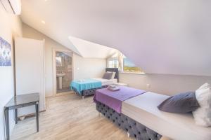 Stunning Suite in Ölüdeniz with Seaview And Pool客房内的一张或多张床位