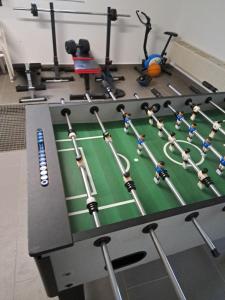 a gym with a table with a soccer game on it at Mony land in Netphen