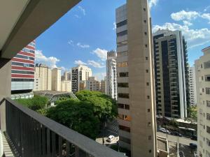 a view of a city from a balcony at Studio Completo na Haddock Lobo in São Paulo