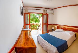 Katil atau katil-katil dalam bilik di Garapua Praia Hotel
