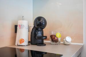 a kitchen counter with a coffee maker on a shelf at Route 66 in Rijeka +26 photos